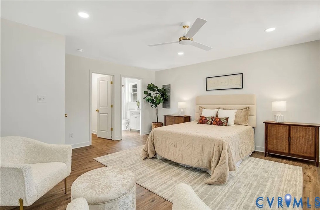 14915 Lebanon Road Spring Grove, VA 23881 - Photo 4 of 6 a bedroom with a large bed and a couch