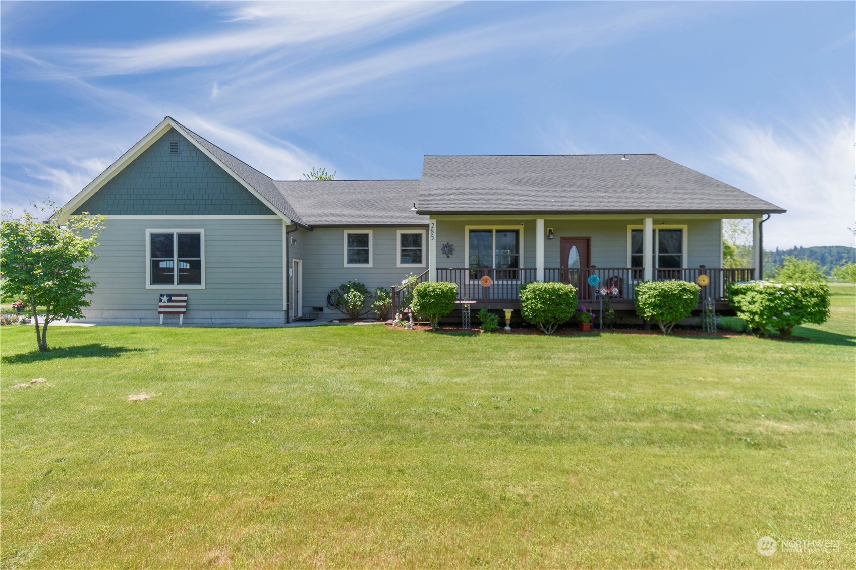 a front view of house with yard and green space