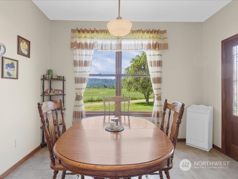 285 West Birnie Slough Road Cathlamet, WA 98612 - Photo 14 of 40 a dining room with furniture and window