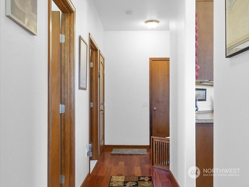 285 West Birnie Slough Road Cathlamet, WA 98612 - Photo 15 of 40 a view of hallway with livingroom and wooden floor