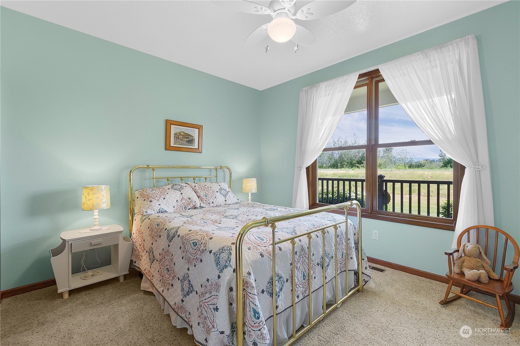 285 West Birnie Slough Road Cathlamet, WA 98612 - Photo 23 of 40 a bedroom with a bed and a window