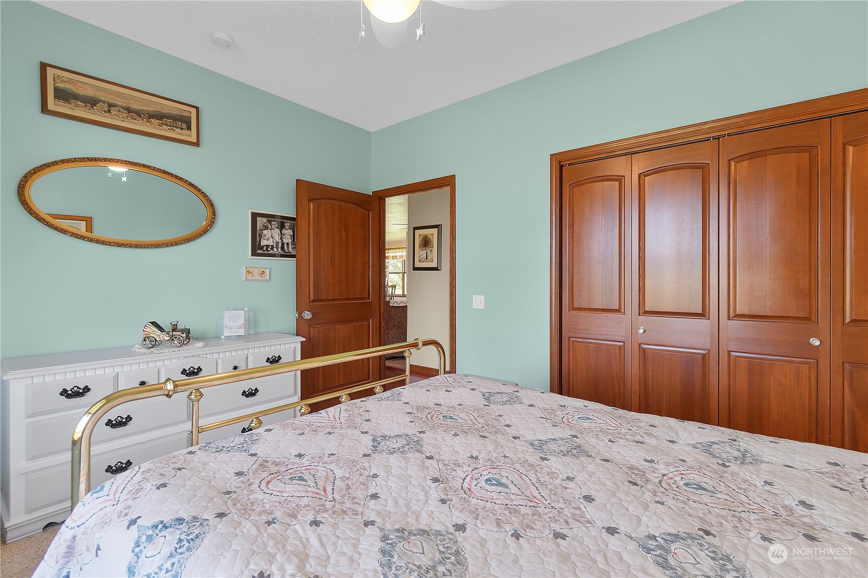 285 West Birnie Slough Road Cathlamet, WA 98612 - Photo 24 of 40 a bedroom with a bed and a dresser
