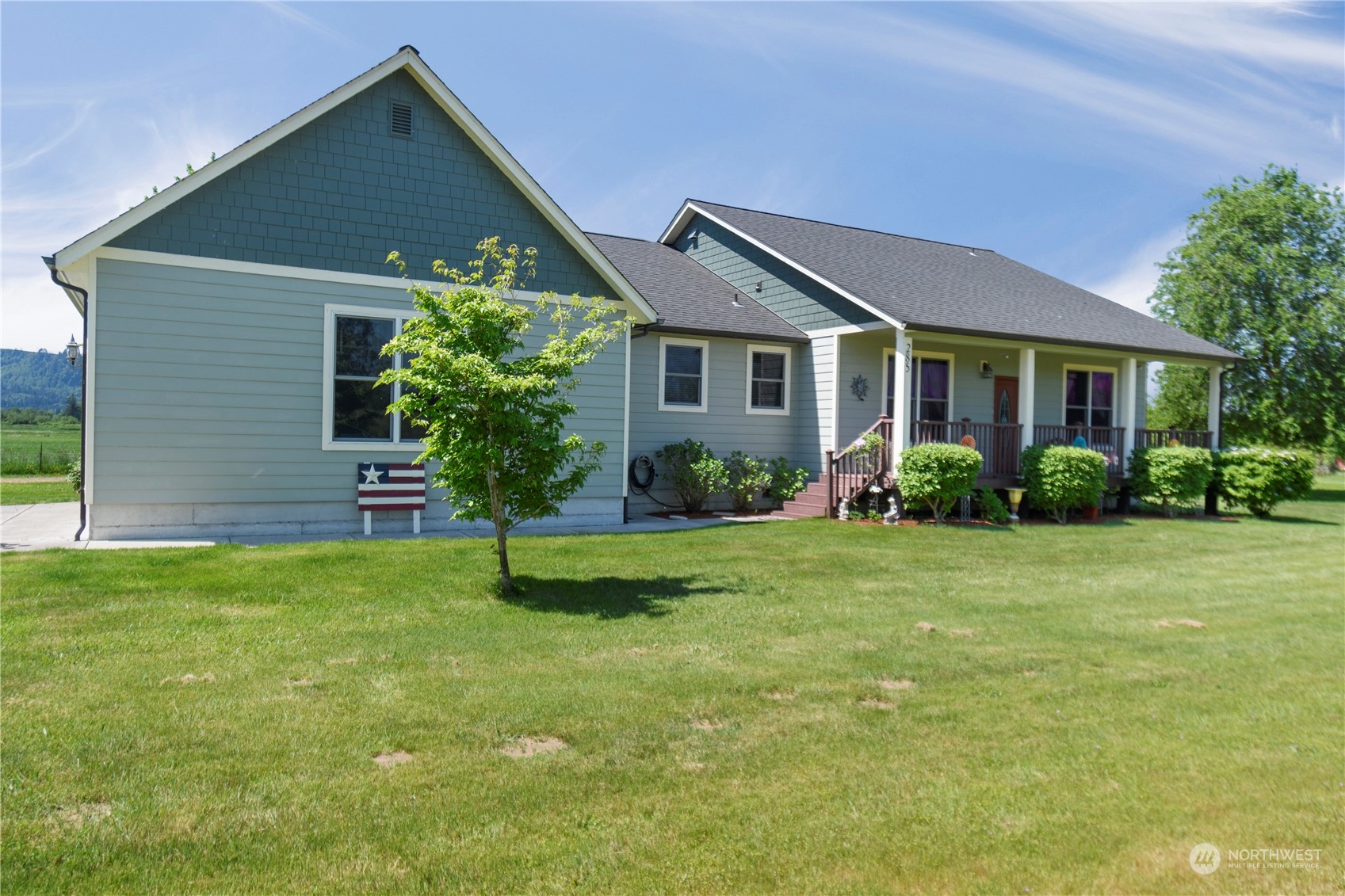 285 West Birnie Slough Road Cathlamet, WA 98612 - Photo 26 of 40 a house that is sitting in the grass