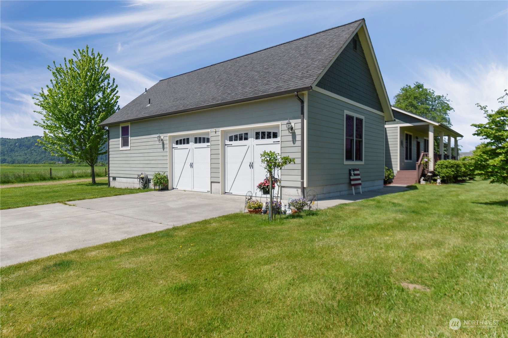 285 West Birnie Slough Road Cathlamet, WA 98612 - Photo 28 of 40 a view of a house with backyard and a tree