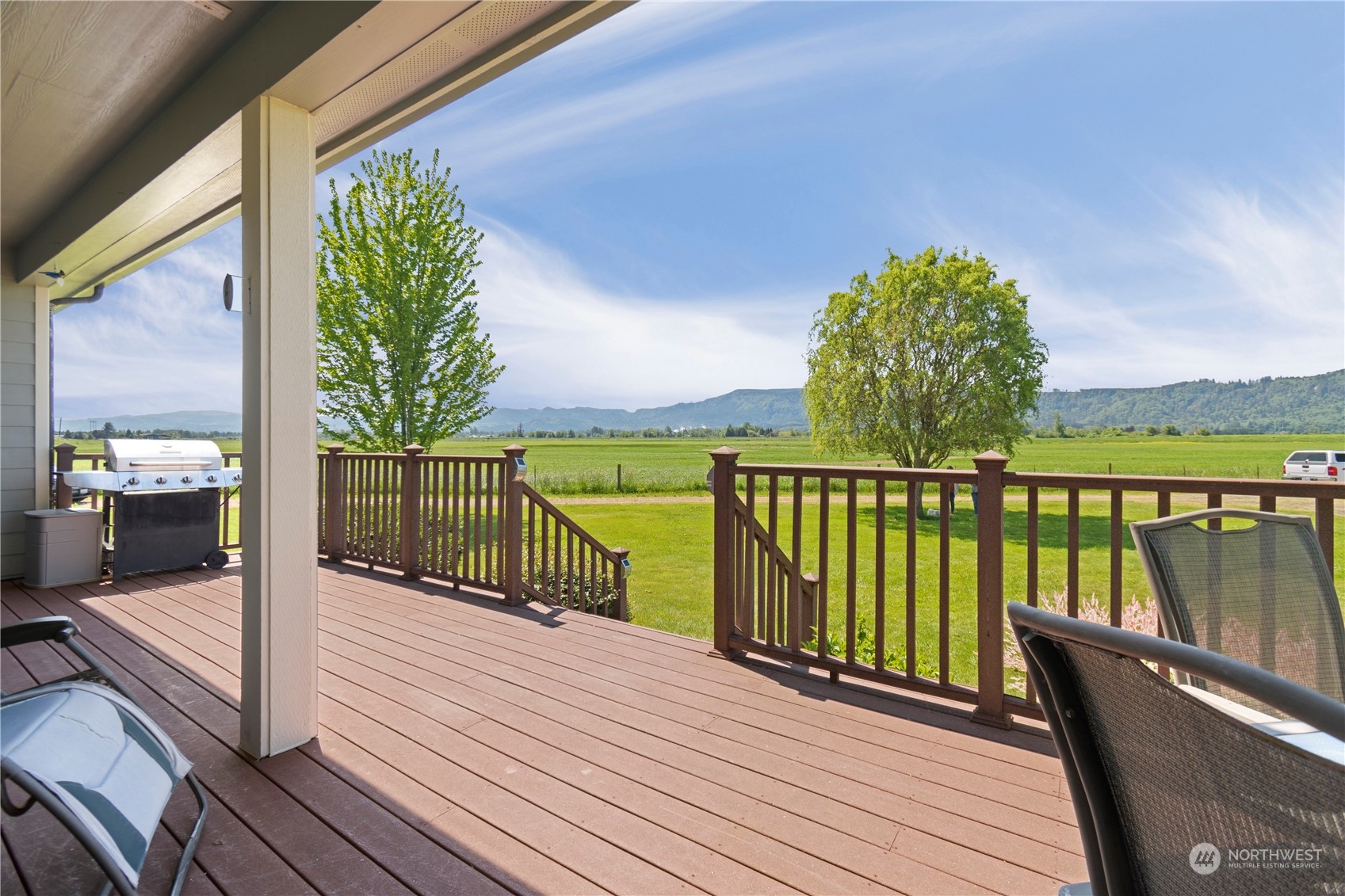 285 West Birnie Slough Road Cathlamet, WA 98612 - Photo 34 of 40 a balcony with wooden floor