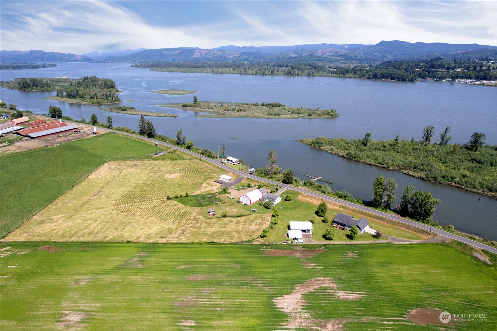 285 West Birnie Slough Road Cathlamet, WA 98612 - Photo 4 of 40 a view of a lake with a mountain