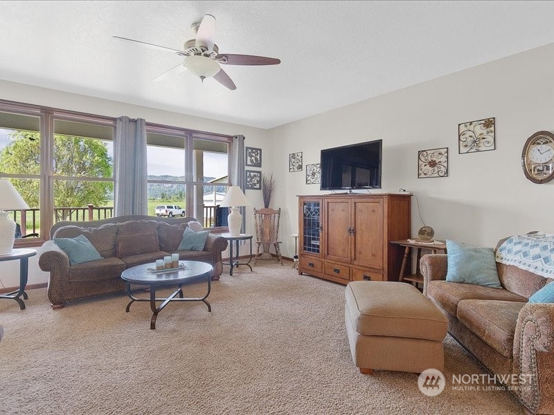 285 West Birnie Slough Road Cathlamet, WA 98612 - Photo 5 of 40 a living room with furniture and a flat screen tv