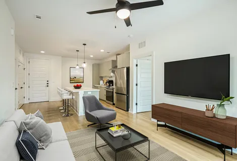 a living room with furniture and a flat screen tv