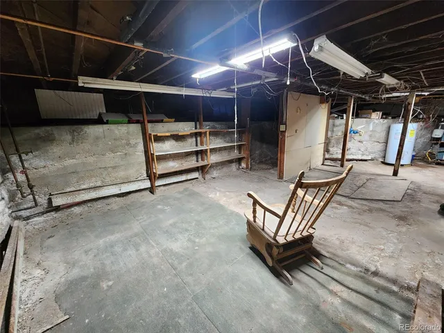a view of an empty room with wooden walls