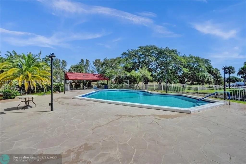 7051 Environ Boulevard, Unit 337 Lauderhill, FL 33319 - Photo 13 of 15 a view of a tennis court