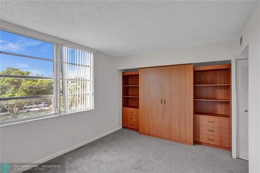7051 Environ Boulevard, Unit 337 Lauderhill, FL 33319 - Photo 14 of 15 a view of room with walk in closet and window