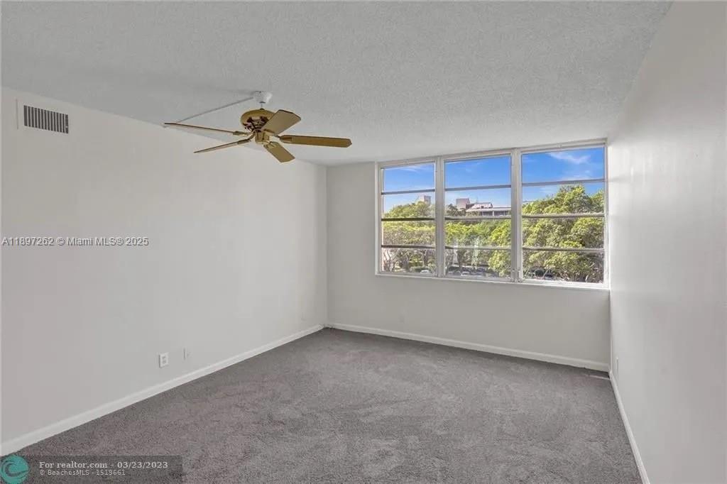 7051 Environ Boulevard, Unit 337 Lauderhill, FL 33319 - Photo 7 of 15 a view of an empty room with a window