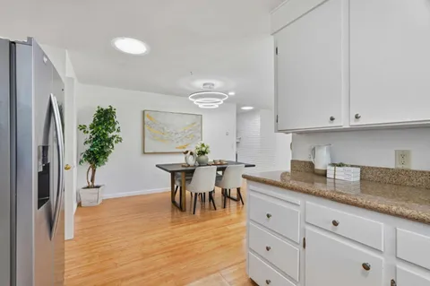 a view of dining table chairs and entryway