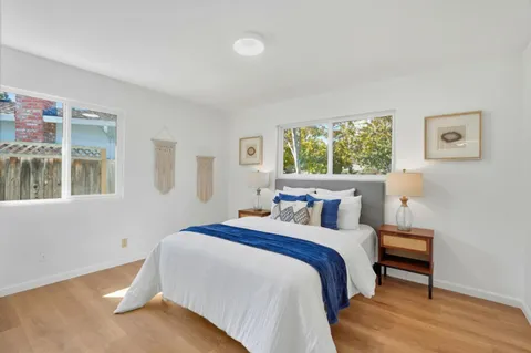 a bed room with a bed and a window