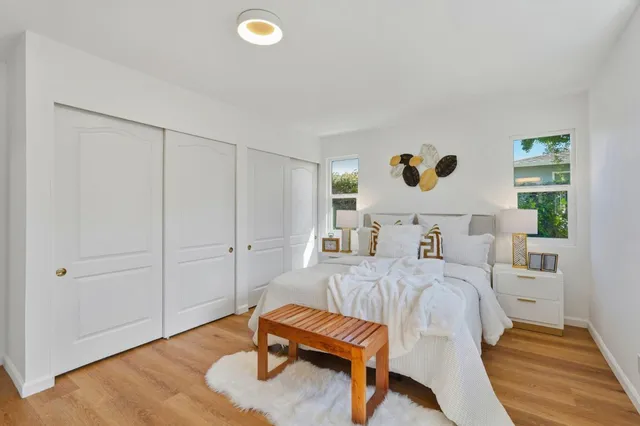 a bedroom with a bed and a cabinets