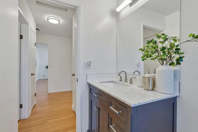 a bathroom with a sink and a mirror