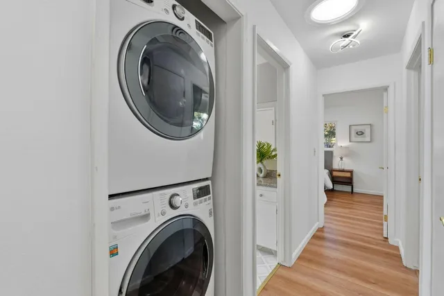 a view of a hallway with washer and dryer