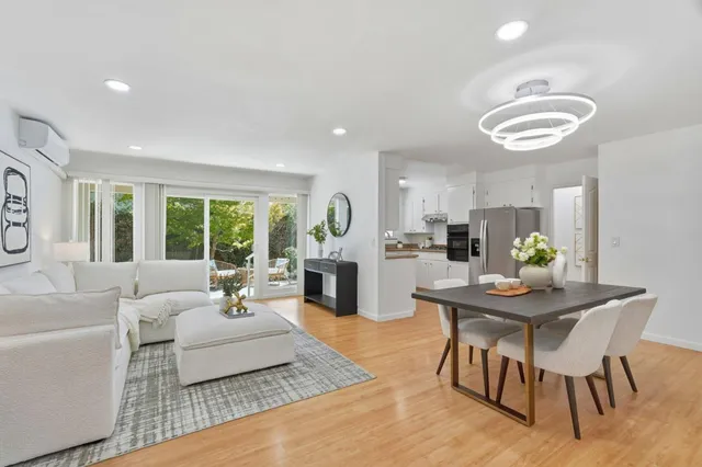 a living room with furniture fireplace and window