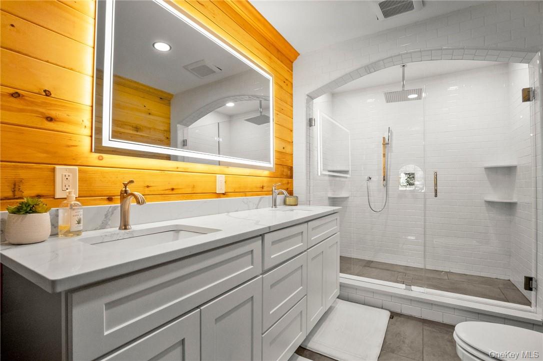 55 Daley Road Poughkeepsie, NY 12603 - Photo 12 of 38 a bathroom with a sink and a mirror