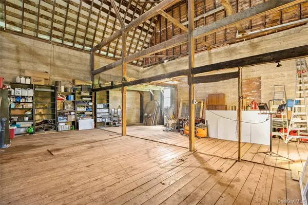 a view of a hall with wooden floor