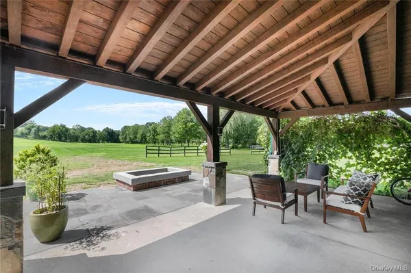 a patio with yard table and chairs