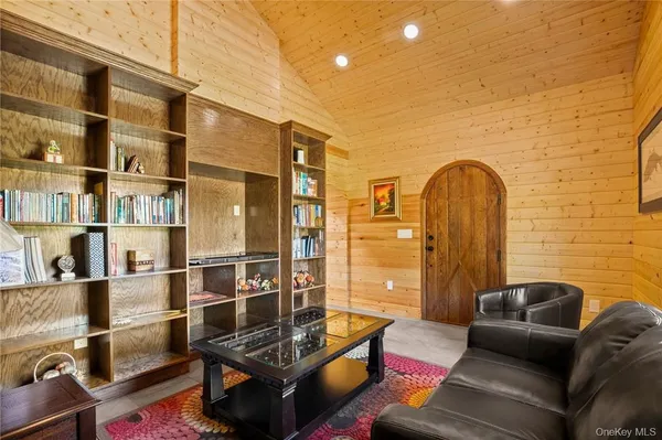 a living room with furniture and a window