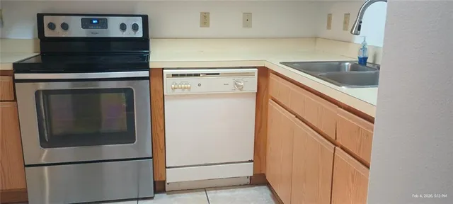 a kitchen with a refrigerator and cabinets