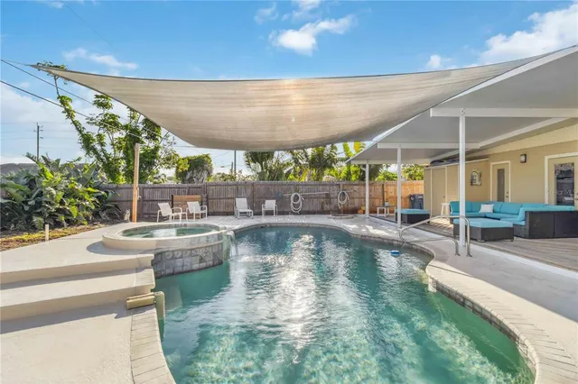 a view of a swimming pool with a patio