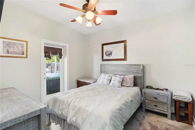 a bathroom with a granite countertop sink toilet a large mirror a shower and vanity