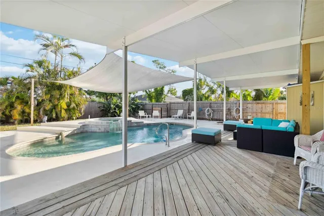 a view of a swimming pool with a patio