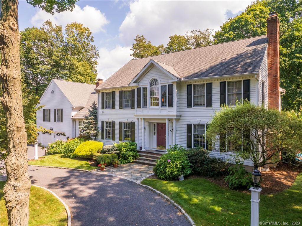 a front view of a house with a porch and livingroom