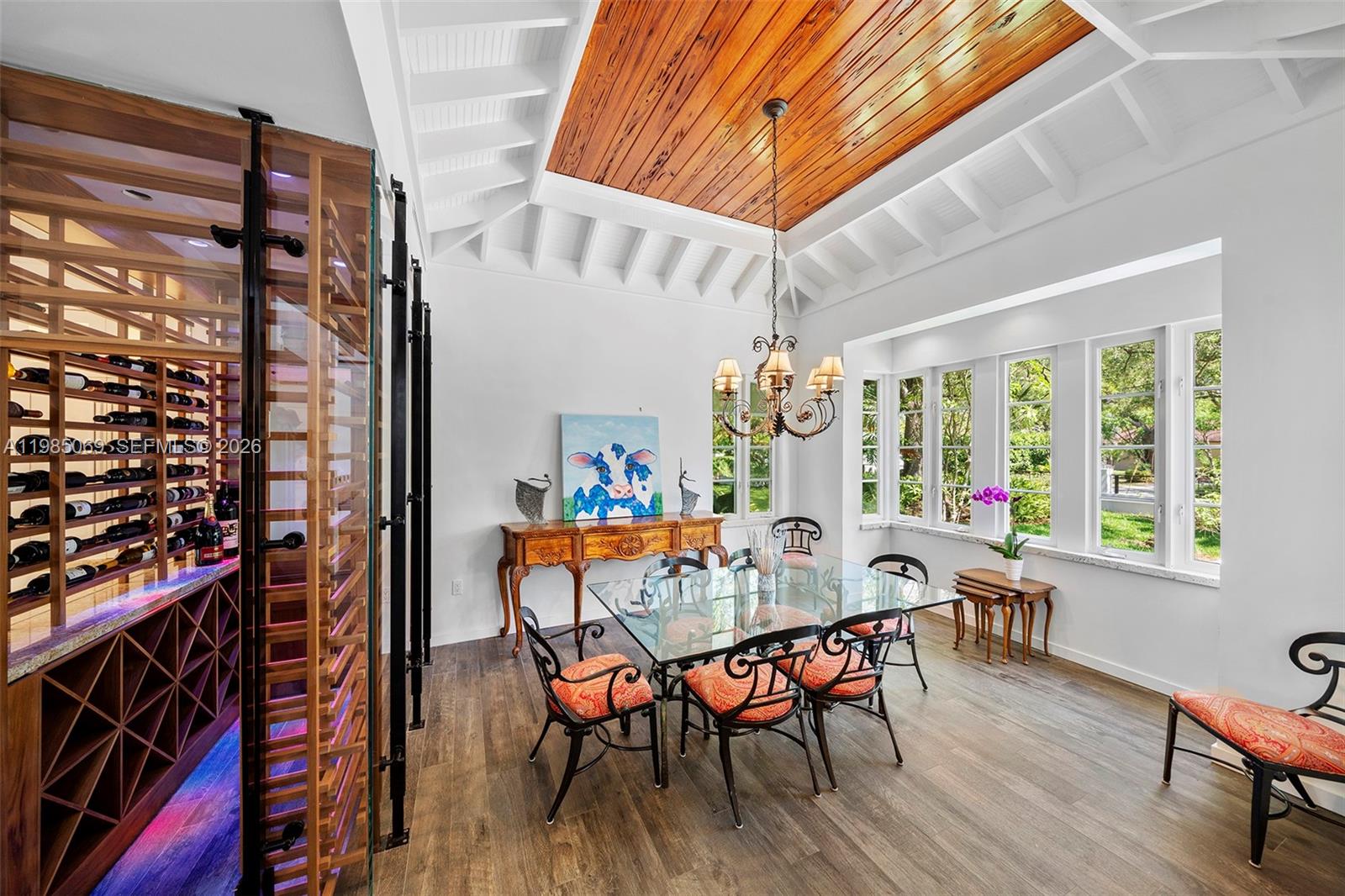 6700 Southwest 132nd Street Pinecrest, FL 33156 - Photo 14 of 99 a dining room with furniture and wooden floor