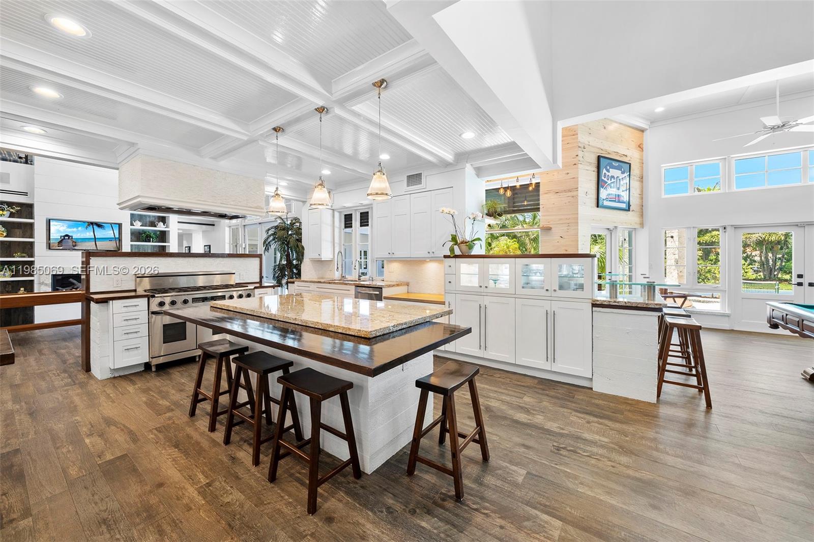 6700 Southwest 132nd Street Pinecrest, FL 33156 - Photo 20 of 99 a kitchen with a table and chairs in it