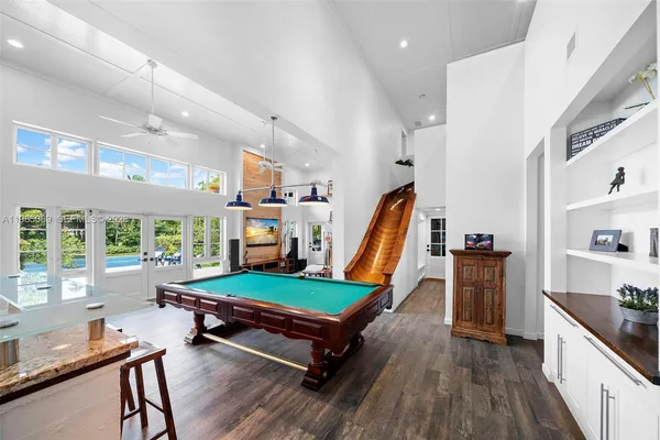 a bedroom with a bed and a balcony view