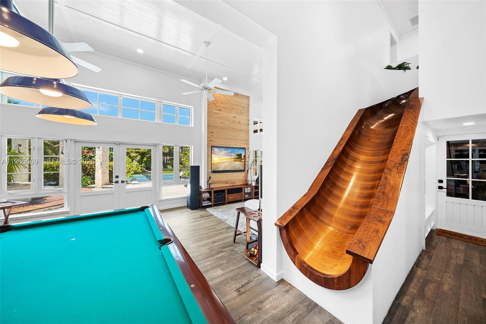 6700 Southwest 132nd Street Pinecrest, FL 33156 - Photo 28 of 99 Custom 2 story black walnut hand carved wooden slide