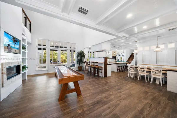 a living room with furniture windows and wooden floor