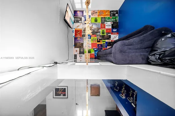 an aerial view of a house with a yard basket ball court and outdoor seating