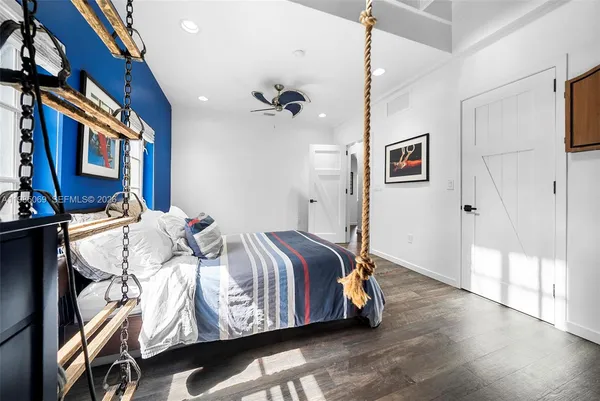 an aerial view of a house with swimming pool and garden