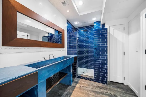 an aerial view of a house with yard swimming pool and outdoor seating