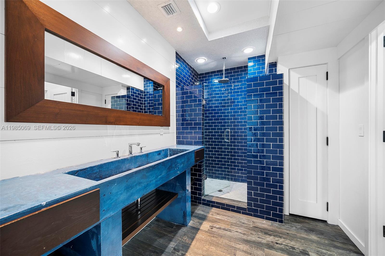 6700 Southwest 132nd Street Pinecrest, FL 33156 - Photo 46 of 99 a bathroom with a sink and a mirror