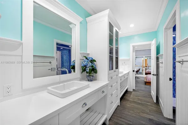 an aerial view of residential house with parking and yard