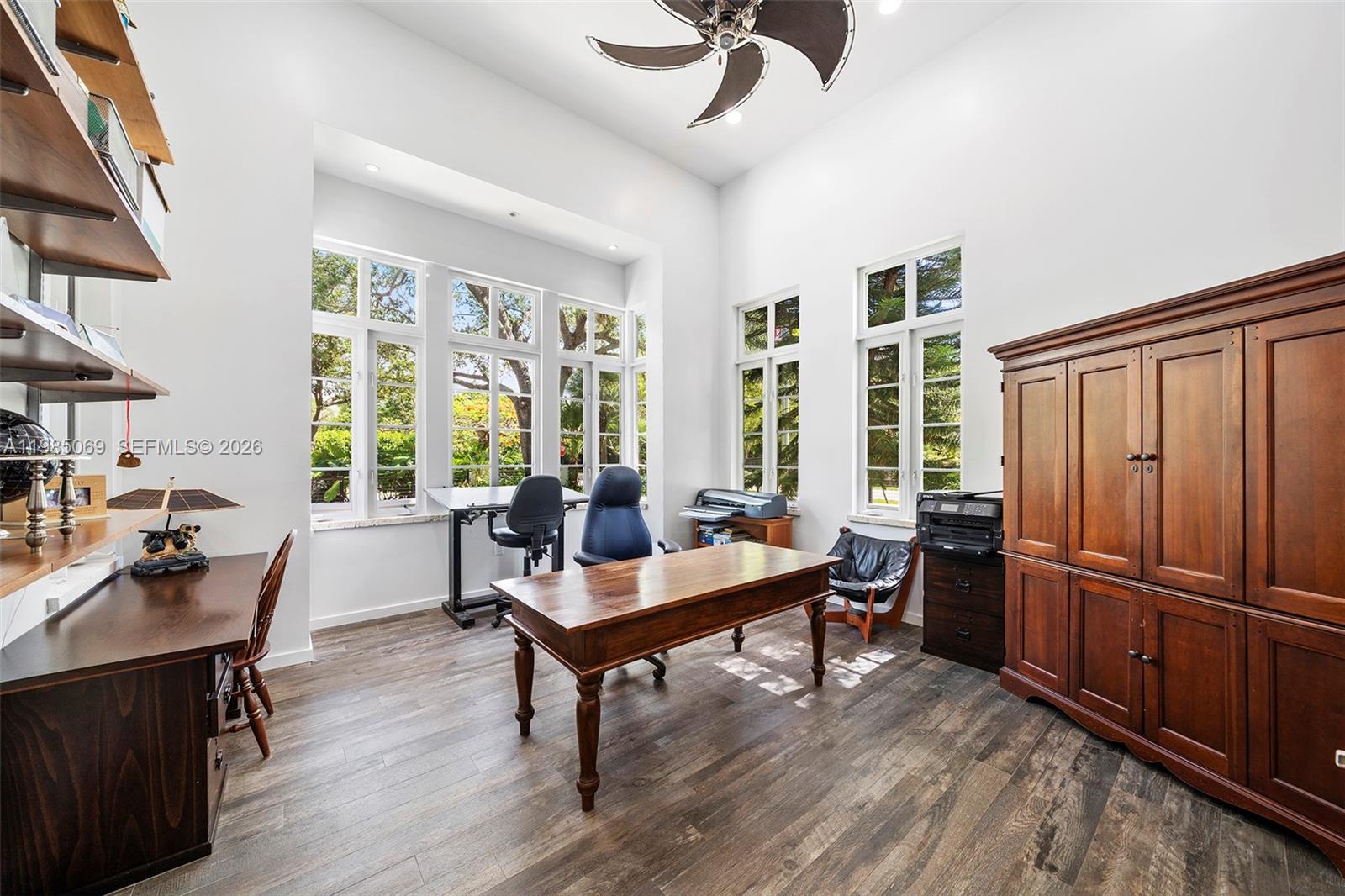6700 Southwest 132nd Street Pinecrest, FL 33156 - Photo 59 of 99 a living room with furniture windows and wooden floor