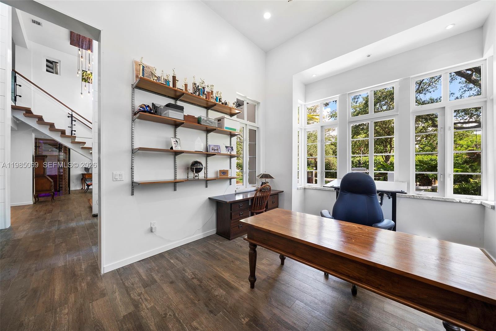 6700 Southwest 132nd Street Pinecrest, FL 33156 - Photo 60 of 99 a view of a workspace with furniture and a window
