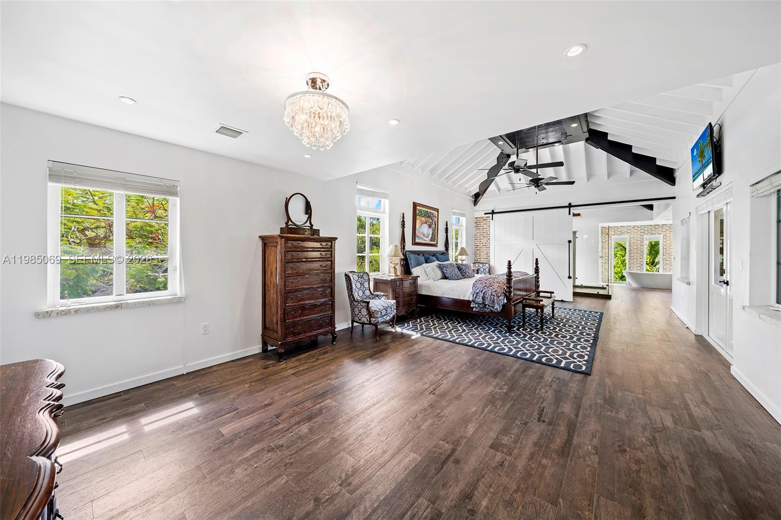 6700 Southwest 132nd Street Pinecrest, FL 33156 - Photo 61 of 99 a living room with furniture and a wooden floor