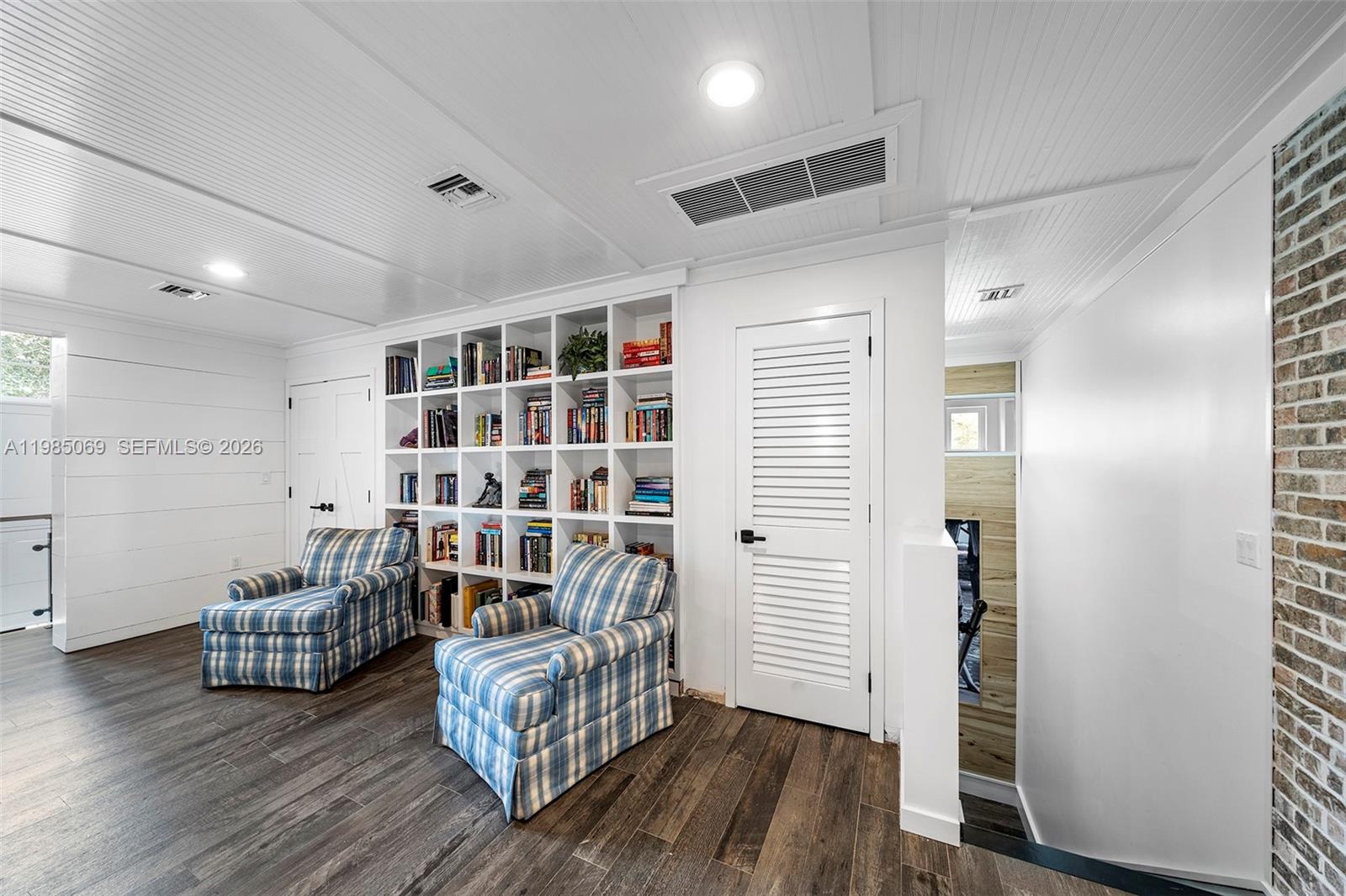 6700 Southwest 132nd Street Pinecrest, FL 33156 - Photo 65 of 99 a living room with furniture and wooden floor