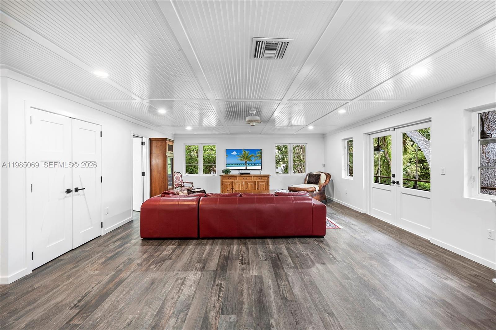 6700 Southwest 132nd Street Pinecrest, FL 33156 - Photo 70 of 99 a living room with hard wood flooring and furniture