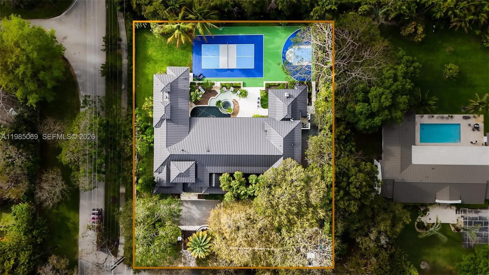 6700 Southwest 132nd Street Pinecrest, FL 33156 - Photo 91 of 99 an aerial view of a house with a yard basket ball court and outdoor seating