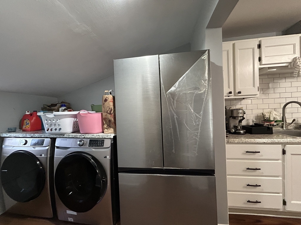 30 Parker Street Lexington, MA 02421 - Photo 6 of 11 a utility room with closet dryer and washer