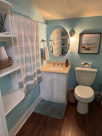 30 Parker Street Lexington, MA 02421 - Photo 7 of 11 a room with a toilet a sink and a mirror
