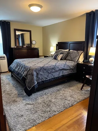 a bedroom with a bed and window